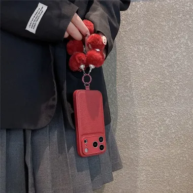 Coque iPhone 17 Pro cuir avec dragonne peluche fleur